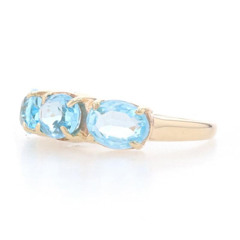 Yellow Gold Blue Topaz Three-Stone Ring - 14k Oval 3.60ctw East-West Set In Excellent Condition For Sale In Greensboro, NC