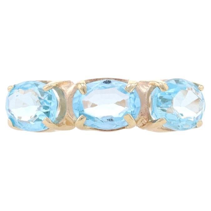 Yellow Gold Blue Topaz Three-Stone Ring - 14k Oval 3.60ctw East-West Set For Sale