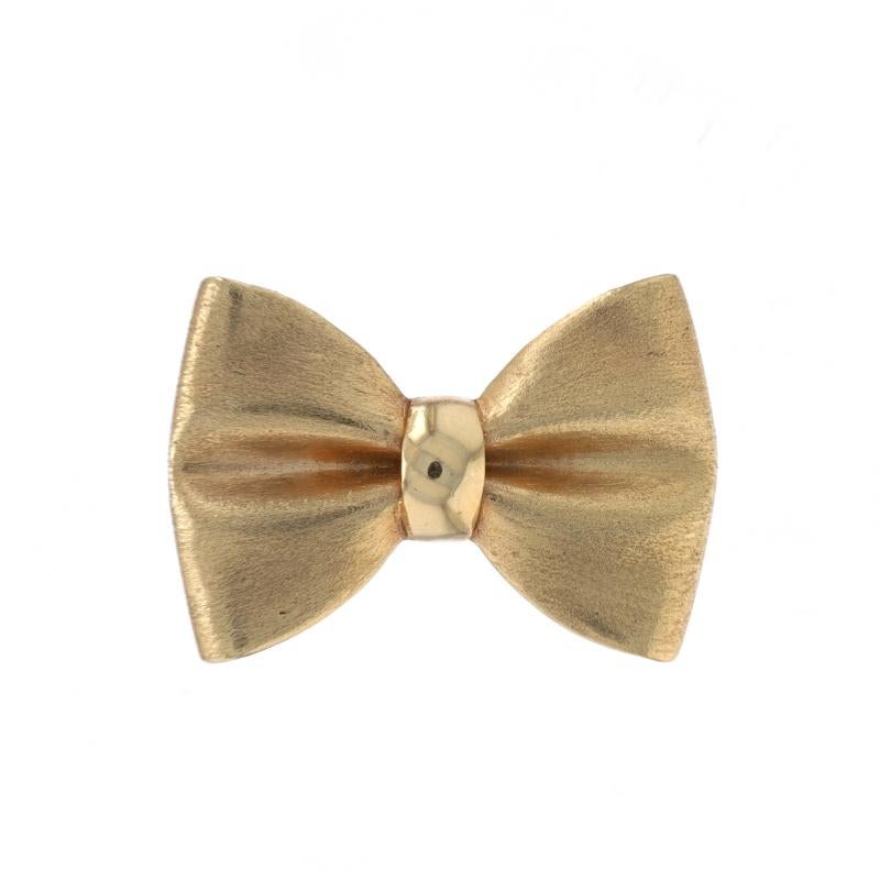 Metal Content: 14k Yellow Gold

Style: Convertible Brooch/Pendant
Fastening Type: Hinged Pin and Whale Tail Clasp
Theme: Bow, Tied Ribbon
Features: Brushed Detailing

Measurements

Tall: 27/32