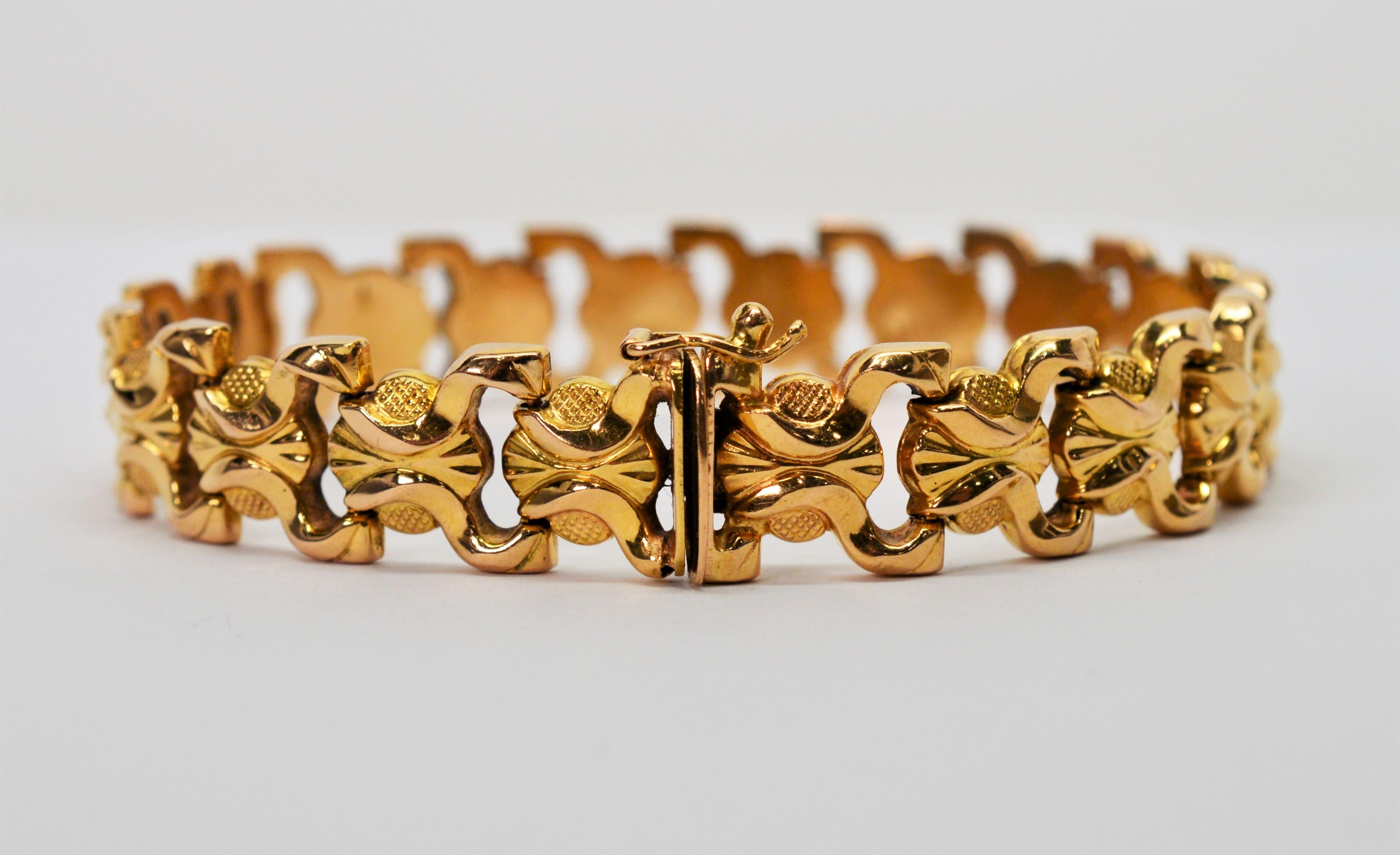 Stylish bow tie medallions of bright eighteen carat 18K yellow gold create this Brevet Italian made 7-5/8 length bracelet. Versatile in a 1/2 inch width that wears nicely on it's own or paired with your other jewelry. Each link is designed with