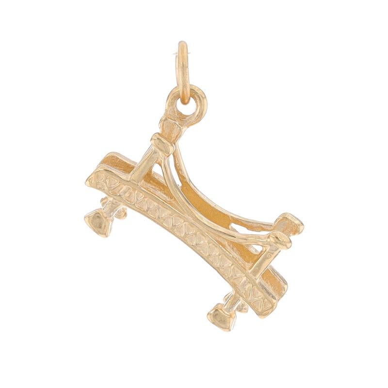Metal Content: 14k Yellow Gold

Theme: Bridge, Transportation Connection Structure
Features: Open Cut Design

Measurements

Tall (from stationary bail): 3/4