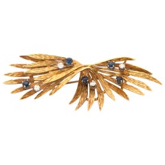 Broche de oro amarillo