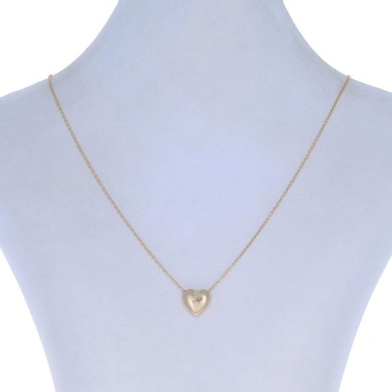 Metal Content: 14k Yellow Gold

Fastening Type: Lobster Claw Clasp
Theme: Heart, Love
Features: Smooth & Brushed Finishes

Measurements

Item 1: Pendant
Tall: 15/32