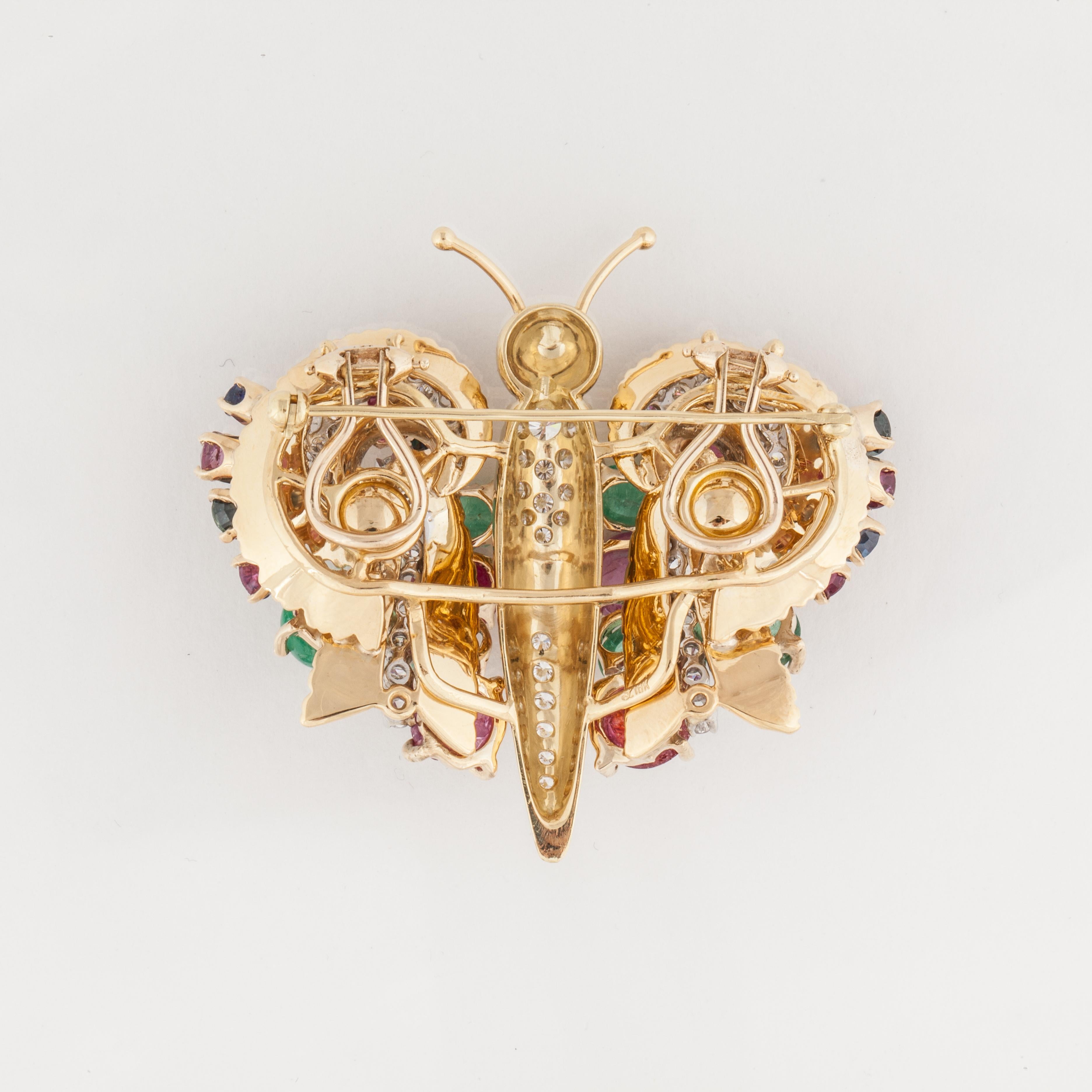 18K yellow gold butterfly convertible brooch/earrings featuring sapphires, emeralds, rubies and diamonds.  The wings are detachable to become a pair of earrings.  There are 54 round diamonds that total 2.15 carats; G-H color and VVS2-VS clarity.  In