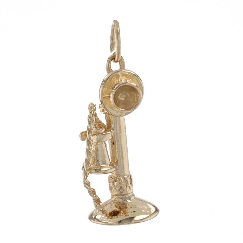 Metal Content: 14k Yellow Gold

Theme: Candlestick Telephone, Old Fashioned Upright Phone 
Features:  The mouthpiece moves up and down.

Measurements

Tall (from stationary bail): 7/8