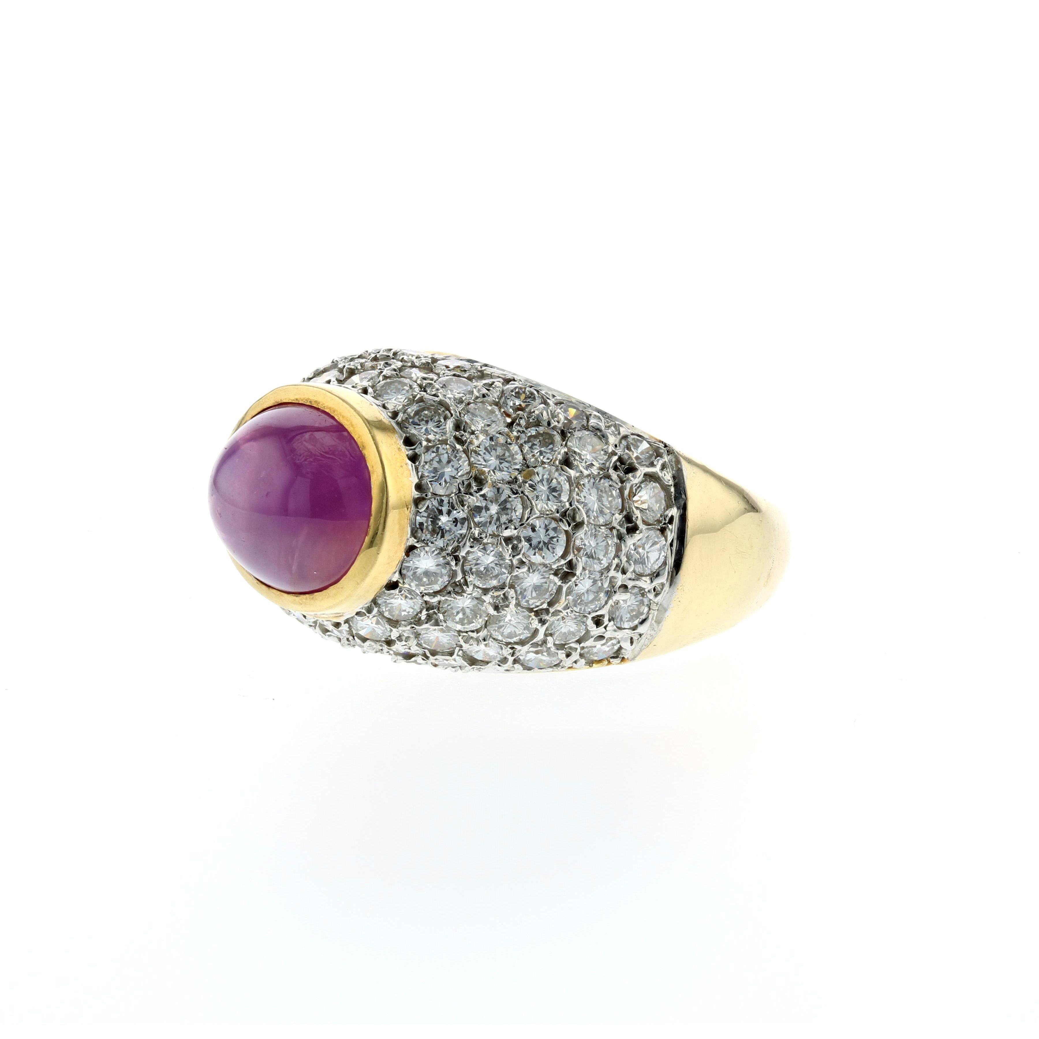 18K yellow gold bombé style ring featuring a pink star sapphire accented by pavé round diamonds.  The star sapphire totals 6.50 carats, accompanied by a GIA report; natural color, no treatment.  Additionally, there are 80 round brilliant-cut