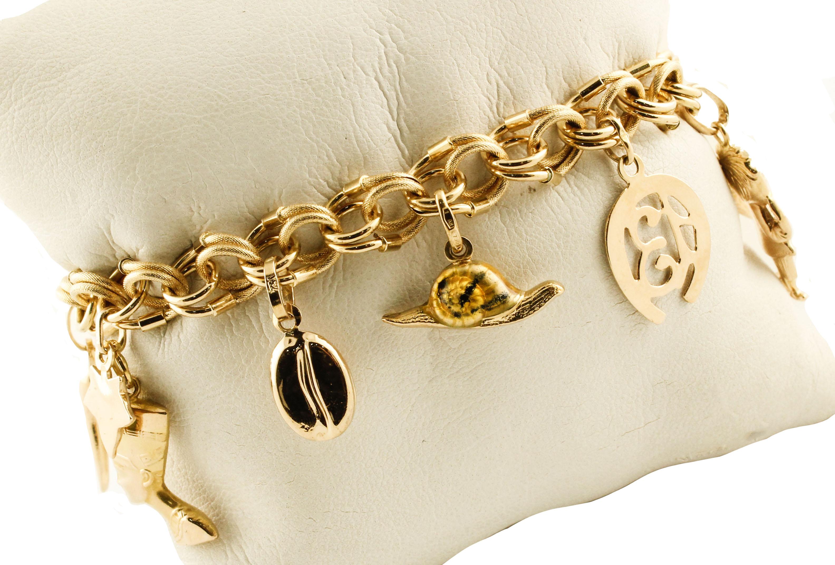 Gorgeous 18K yellow gold bracelet composed of different charms, that rapresent cross, heart, anchor, acorn, fish, child, good luck horseshoe, snail, coffee bean, leaves, egyptian, horn good luck amulet.
This is a good luck bracelet
Total Weight