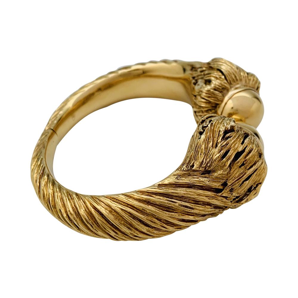 An 18kt textured yellow gold Chaumet bangle. 
Typical design from the 70's.
Inside diameter : 165 mm.
Width: 27 mm
Weight : 116,8 grammes
Style Period: Circa 1970
