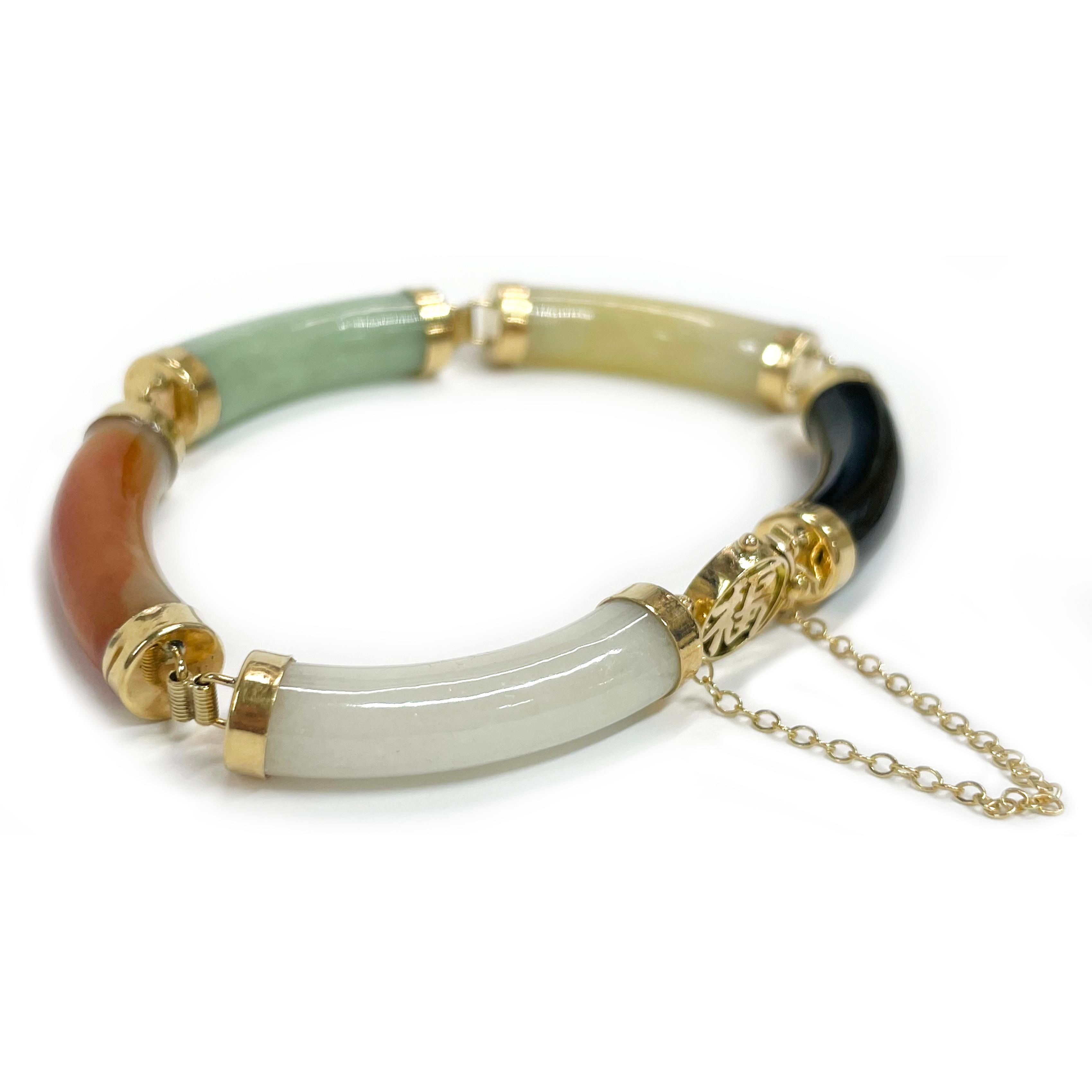 14 Karat Yellow Gold Chinese Multi-Color Jade Link Bracelet. The bracelet features curved tubes of white, marbled red and yellow, light green, and black Jade for a total of five links, each capped in 14k gold and linked with a hinge. The links are