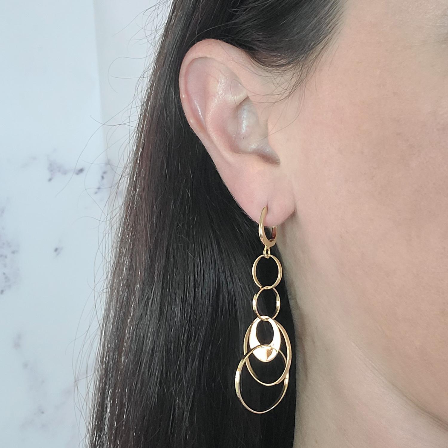 18 Karat Yellow Gold Dangle Disc Earrings Featuring A Huggie Hoop Top. Pierced Post with Hinged Closure. 2.5 Inches Long. Finished Weight Is 7.5 Grams.