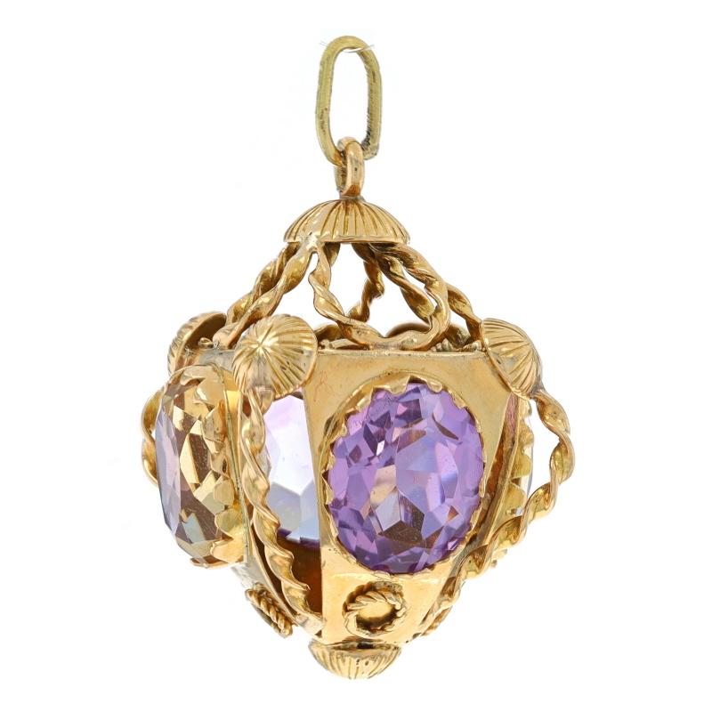 Era: Vintage

Metal Content: 18k Yellow Gold

Stone Information

Natural Citrine
Treatment: Heating
Carat(s): 9ctw
Cut: Oval

Natural Amethyst
Carat(s): 9ctw
Cut: Oval

Total Carats: 18.00ctw

Theme: Ornate, Chunky
Features: Rope Twist Detailing,