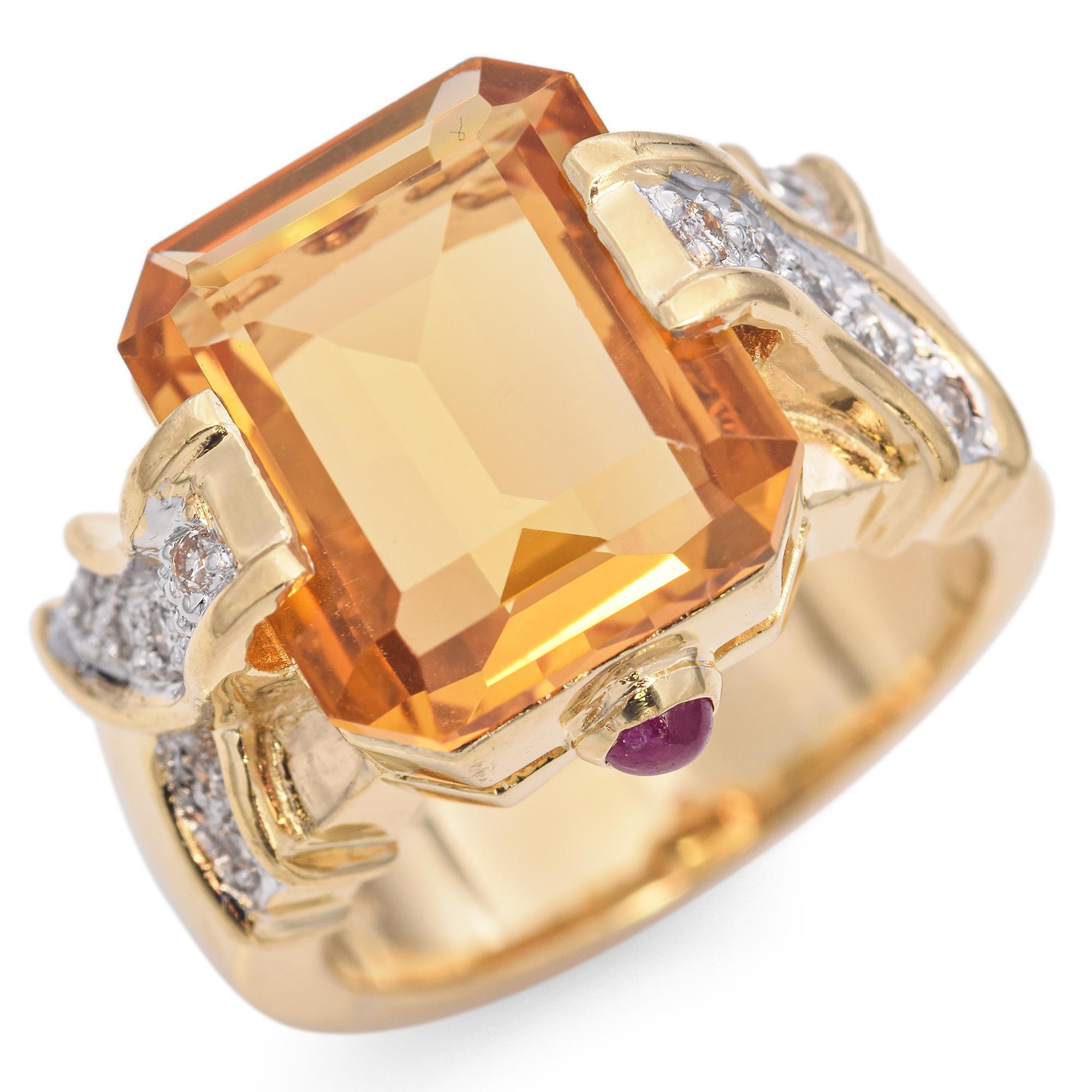 Vintage Citrine Gold Ring, crafted in the 21st century, features a striking emerald-cut citrine set in 18k yellow gold.
The ring showcases intricate gold detailing with diamond accents, enhancing its luxurious appeal.
A small ruby cabochons on the