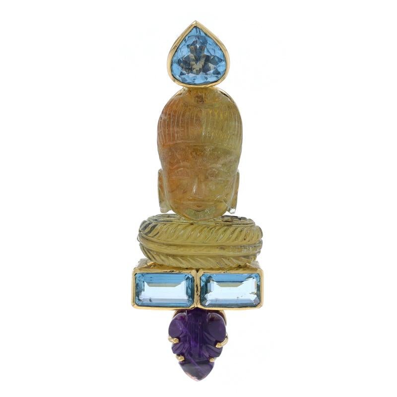 Metal Content: 18k Yellow Gold

Stone Information
Natural Citrine
Treatment: Heating
Cut: Carved
Color: Yellow

Natural Aquamarine
Treatment: Heating
Carat(s): 2.60ct
Cut: Pear
Color: Blue

Natural Aquamarines
Treatment: Heating
Carat(s):