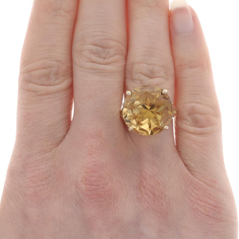 Size: 6 1/4
Sizing Fee: Up 2 sizes for $35 or Down 2 sizes for $30

Metal Content: 14k Yellow Gold

Stone Information

Natural Citrine
Treatment: Heating
Carat(s): 1.65ct
Cut: Round with Star Faceted Pavilion
Color: Orangey Yellow

Total Carats: