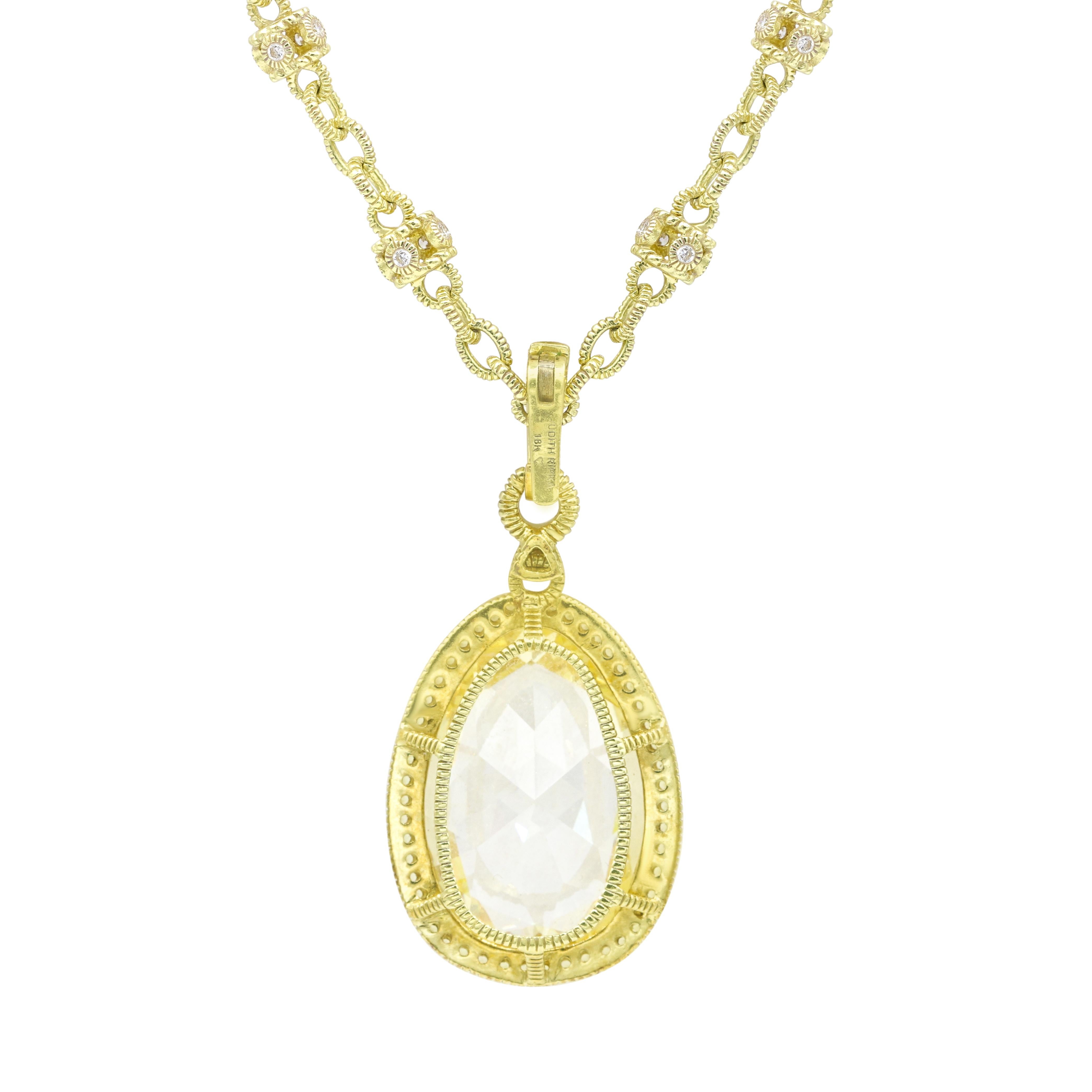 18KT Yellow Gold Citrine, Diamond and Yellow Sapphire Pendant and Diamond Necklace, features 30.00 ct of Oval Citrine, 2.30 ct of Yellow Sapphire on a halo and 1.10 cts of Diamonds.