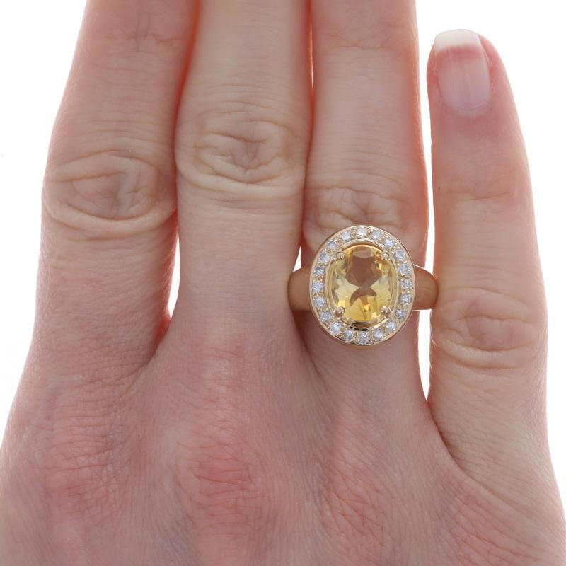 Size: 6 1/2
Sizing Fee: Up 2 sizes for $50 or Down 1 size for $50

Metal Content: 14k Yellow Gold

Stone Information

Natural Citrine
Treatment: Heating
Carat(s): 2.40ct
Cut: Oval
Color: Yellow

Natural Diamonds
Carat(s): .30ctw
Cut: Round