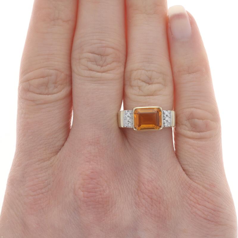 Size: 6 3/4
Sizing Fee: Up 2 sizes for $35 or Down 1 Size for $35

Metal Content: 14k Yellow Gold & 14k White Gold

Stone Information

Natural Citrine
Treatment: Heating
Carat(s): 1.82ct
Cut: Emerald
Color: Orange

Natural Diamonds
Carat(s):