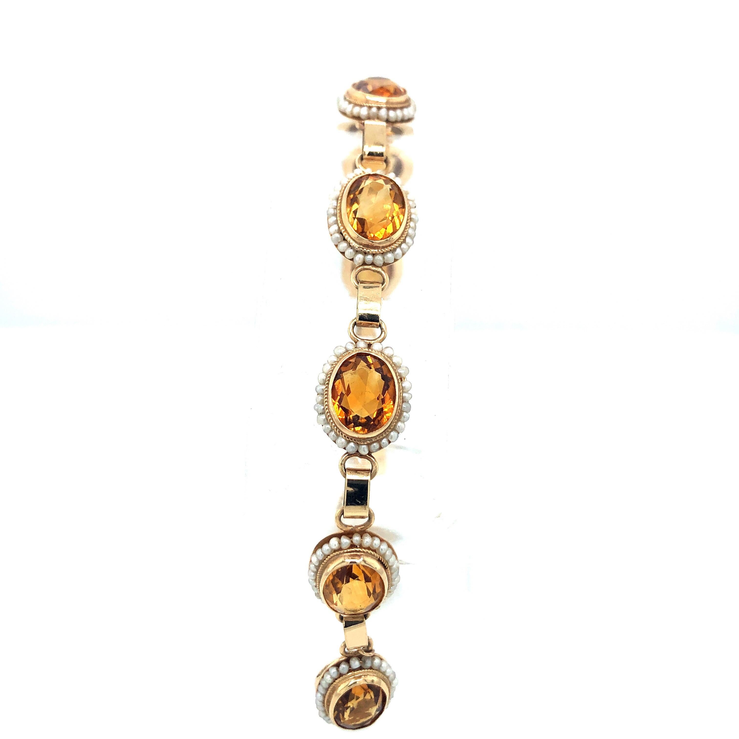 Seed Pearl and Citrine Gold Link Bracelet stamped 14K.  Each station has one citrine surrounded by seed pearls on 14K gold bracelet.  7 inch bracelet, fits a standard size wrist.  Safety chain.  Faceted oval citrines! 