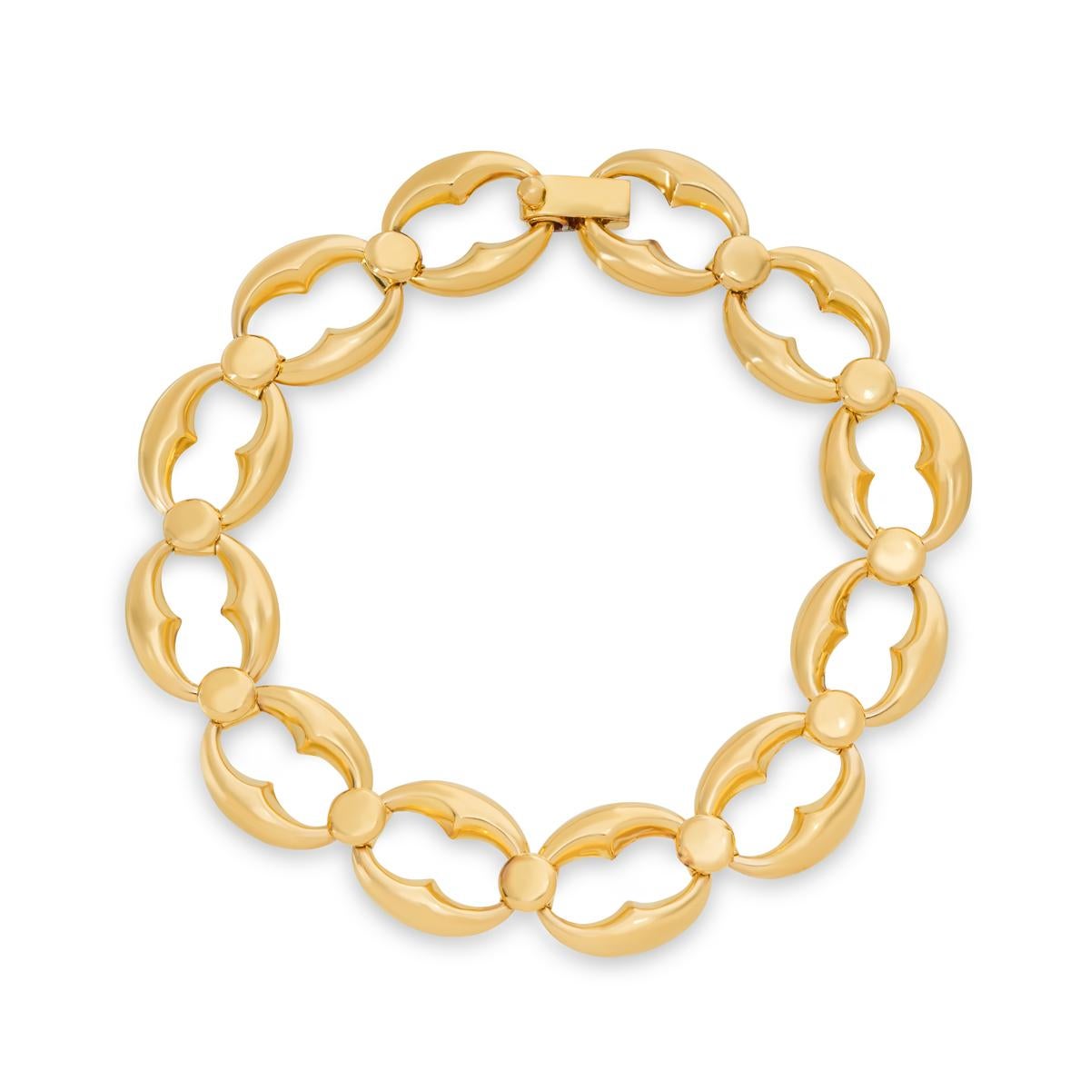 A 22k yellow gold link bracelet. The bracelet features 12 coffee bean links joined together by a round motif. The 7 inch long bracelet finishes with a foldover clasp and has a gross weight of 20.79 grams.

Comes complete with a RichDiamonds