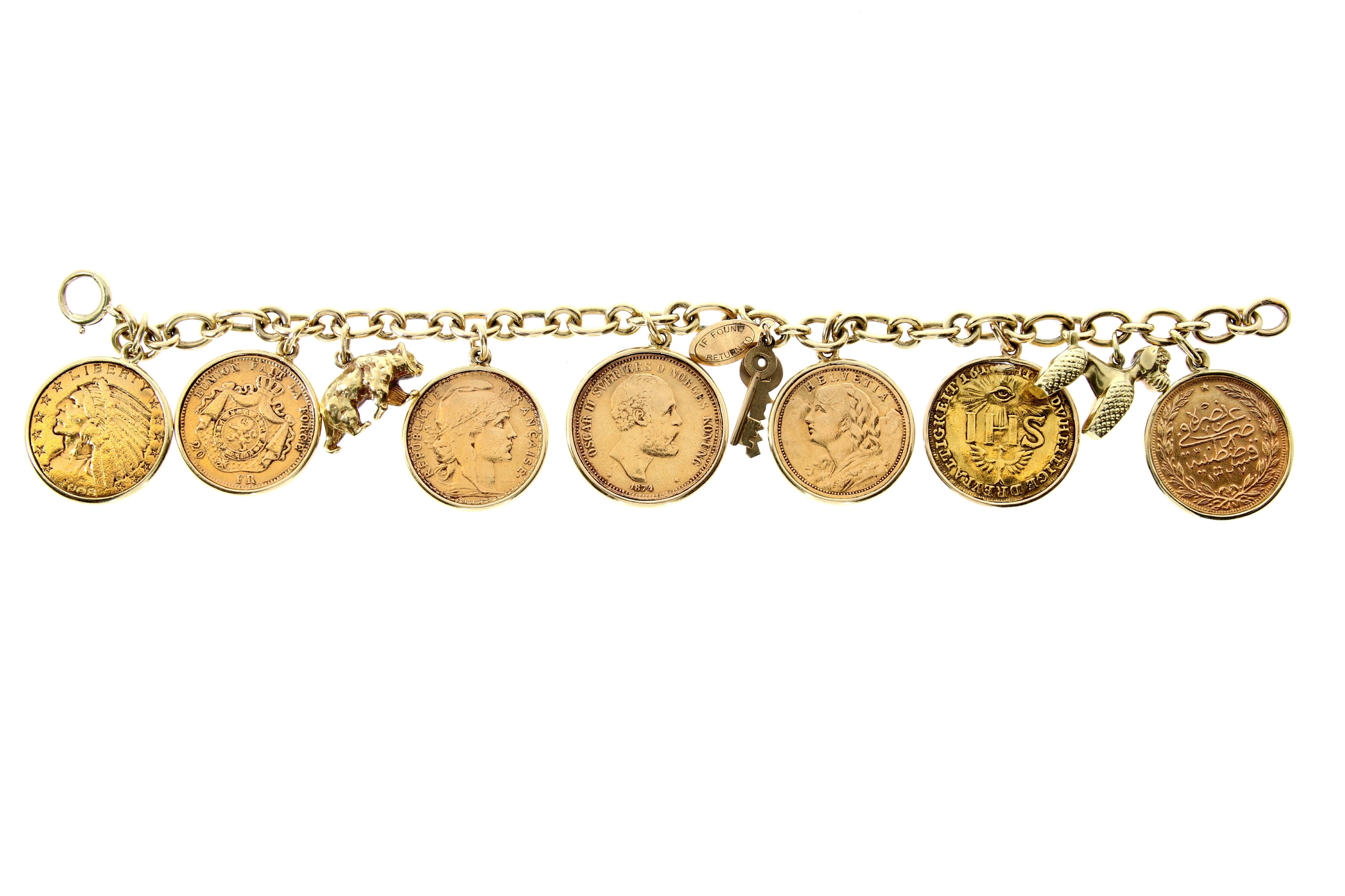 An antique 14-carat yellow gold charm link bracelet. Comprising a dog, a bear and a set of keys and seven framed 21-23 karat gold coins: 
around 1600 Germany/ 1874 Sweden- 20 Kronor/  1876 Belgium- 20 Francs/ 1907 Switzerland- 20 Franken/ 1913