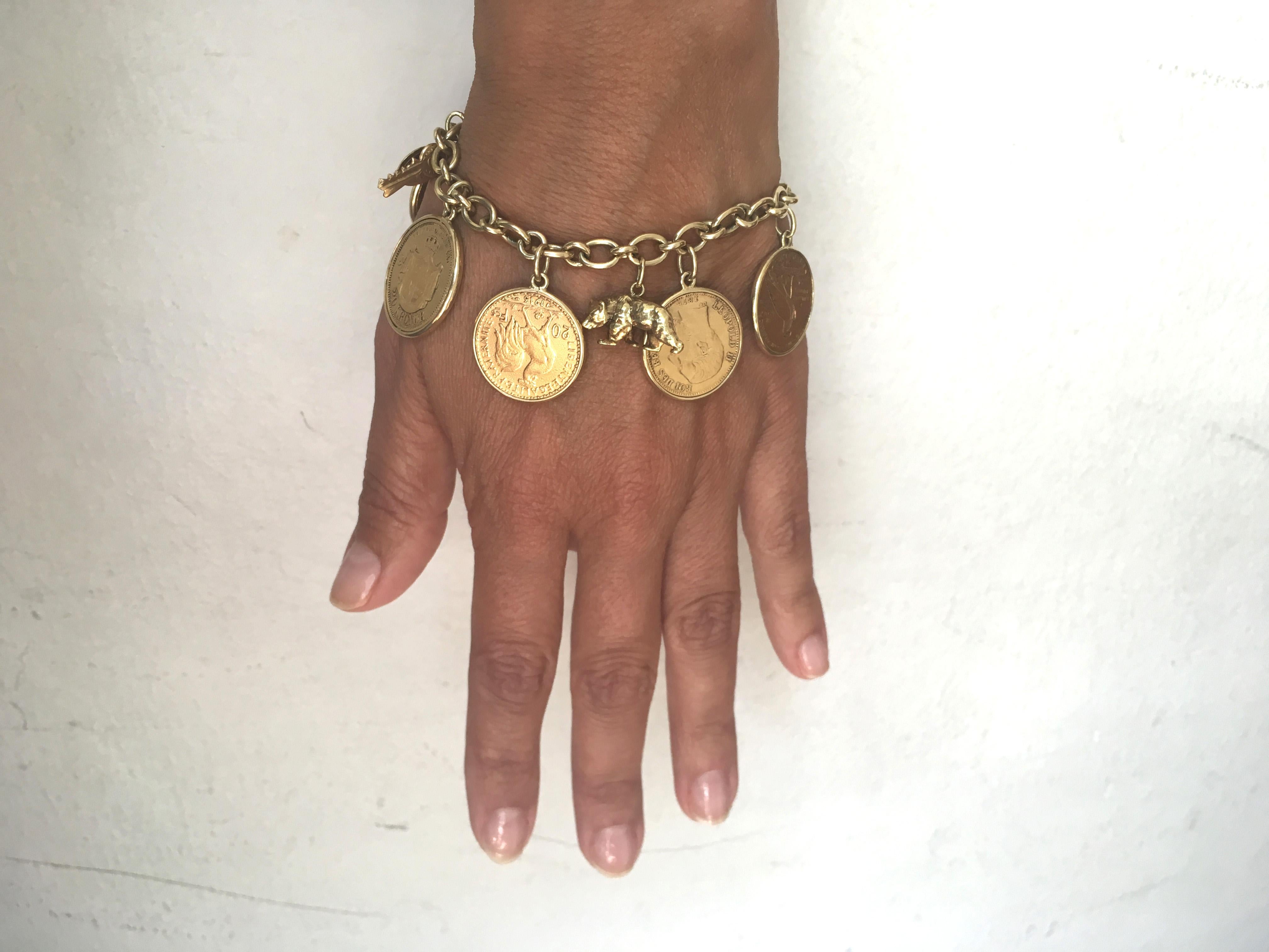Women's Yellow Gold Coins and Charmes Bracelet, circa 1950 For Sale