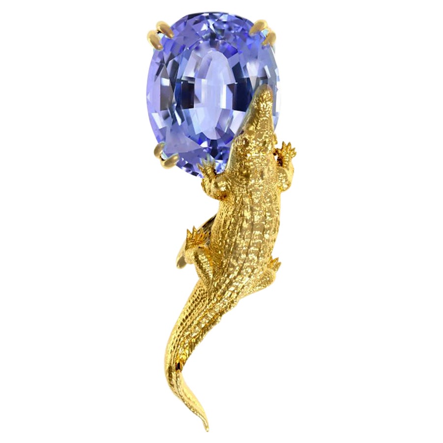 Spilla scultura contemporanea in oro giallo con tanzanite certificata MGL