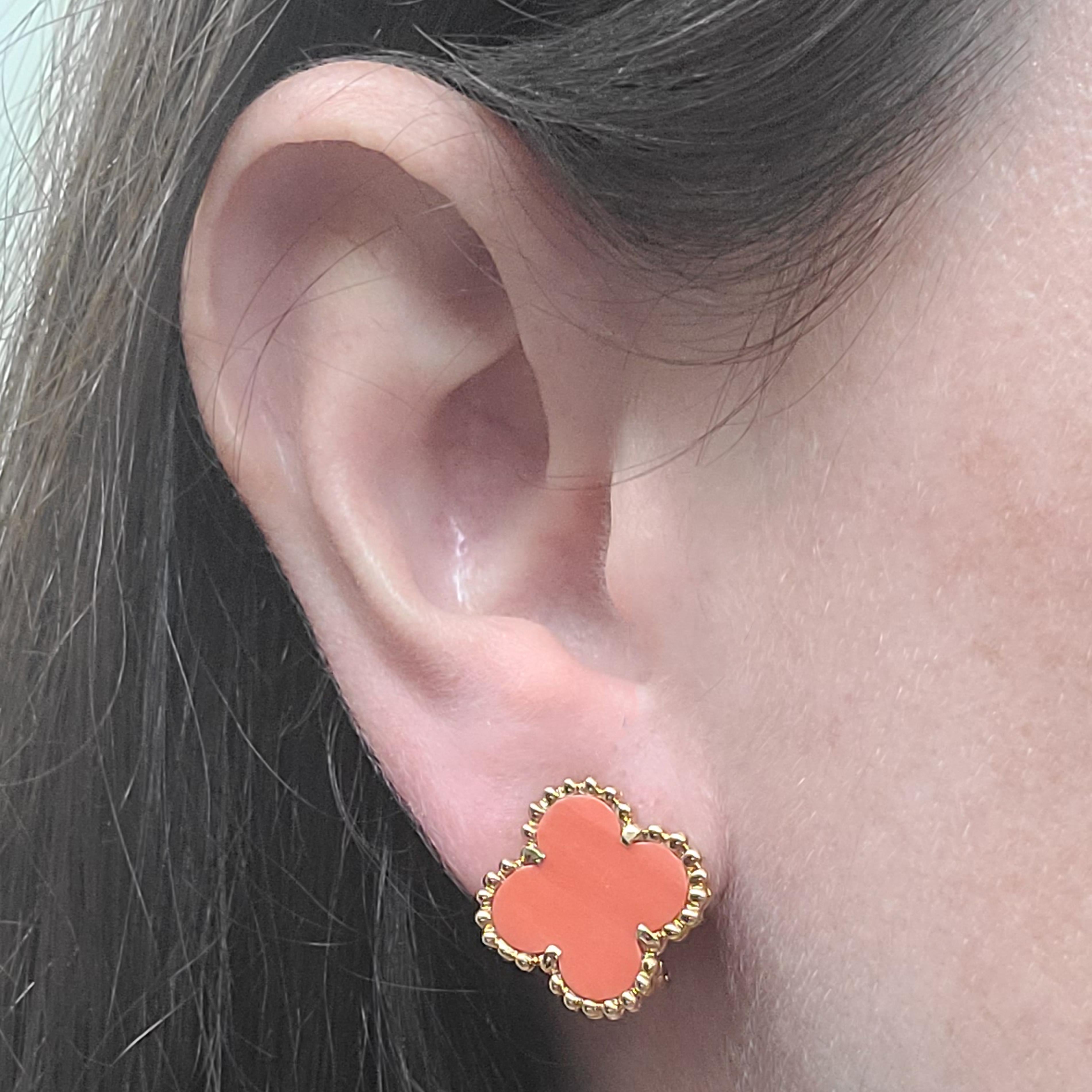 18 Karat Yellow Gold Earrings Featuring 2 Coral Flowers SImilar To Van Cleef & Arpels Alhambra Collection With Textured Edges. Collapsible Pierced Post With Omega Clip Backs. Finished Weight Is 8.0 Grams.

Matching Necklace Also Available.