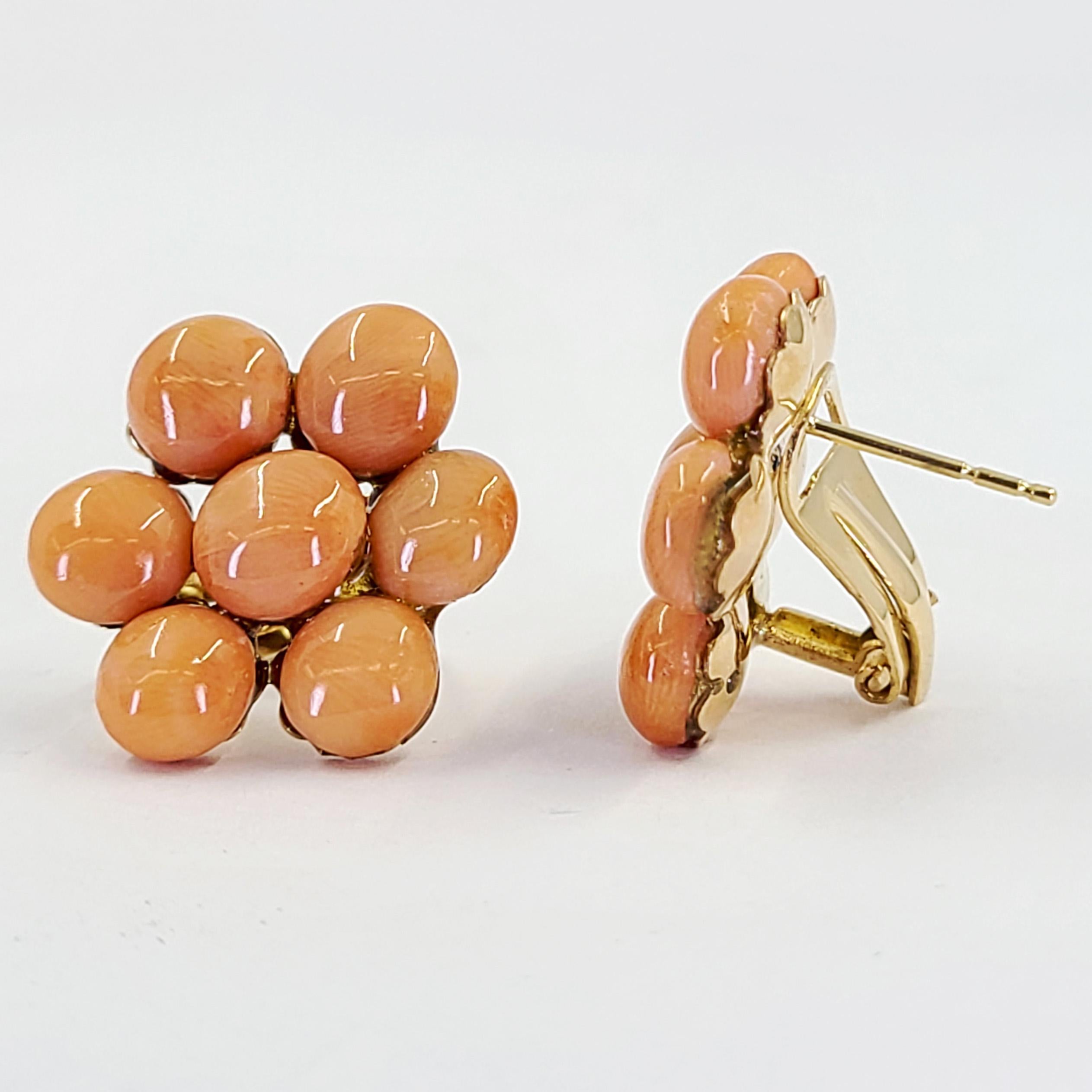 18 Karat Yellow Gold Earrings Featuring 14 7mm Round Cabochon Cut Corals. Pierced Post With Omega Clip Back. Finished Weight Is 9.1 Grams.