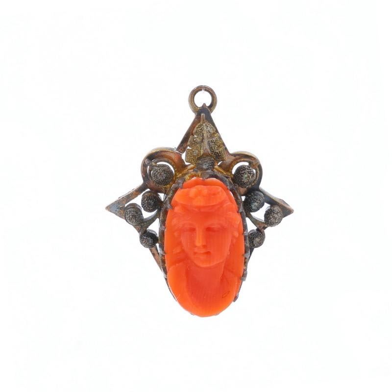 Era: Victorian
Date: 1860s - 1870s

Metal Content: 10k Yellow Gold

Stone Information

Natural Coral
Cut: Cameo
Color: Orange
Size: 15mm x 8.5mm

Style: Solitaire
Theme: Silhouette

Measurements

Tall (from stationary bail): 31/32