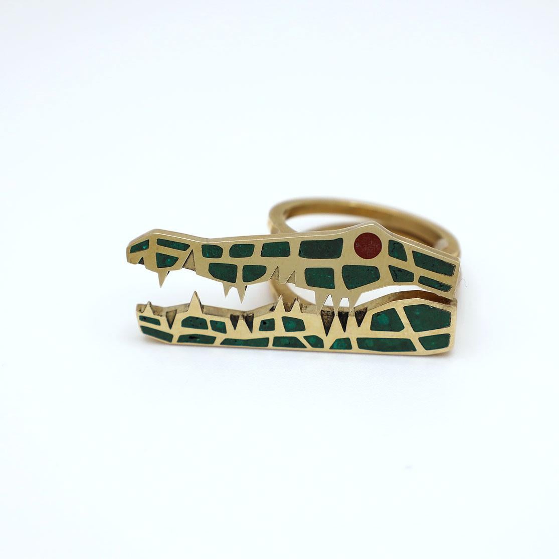 Gold Crocodile Ring with Malachite Inlay by KRSN Studio

This contemporary piece reinterprets the stackable ring. Made of 10K yellow gold, the piece consists of two individual rings, which interlock to form the profile of a crocodile. When slid