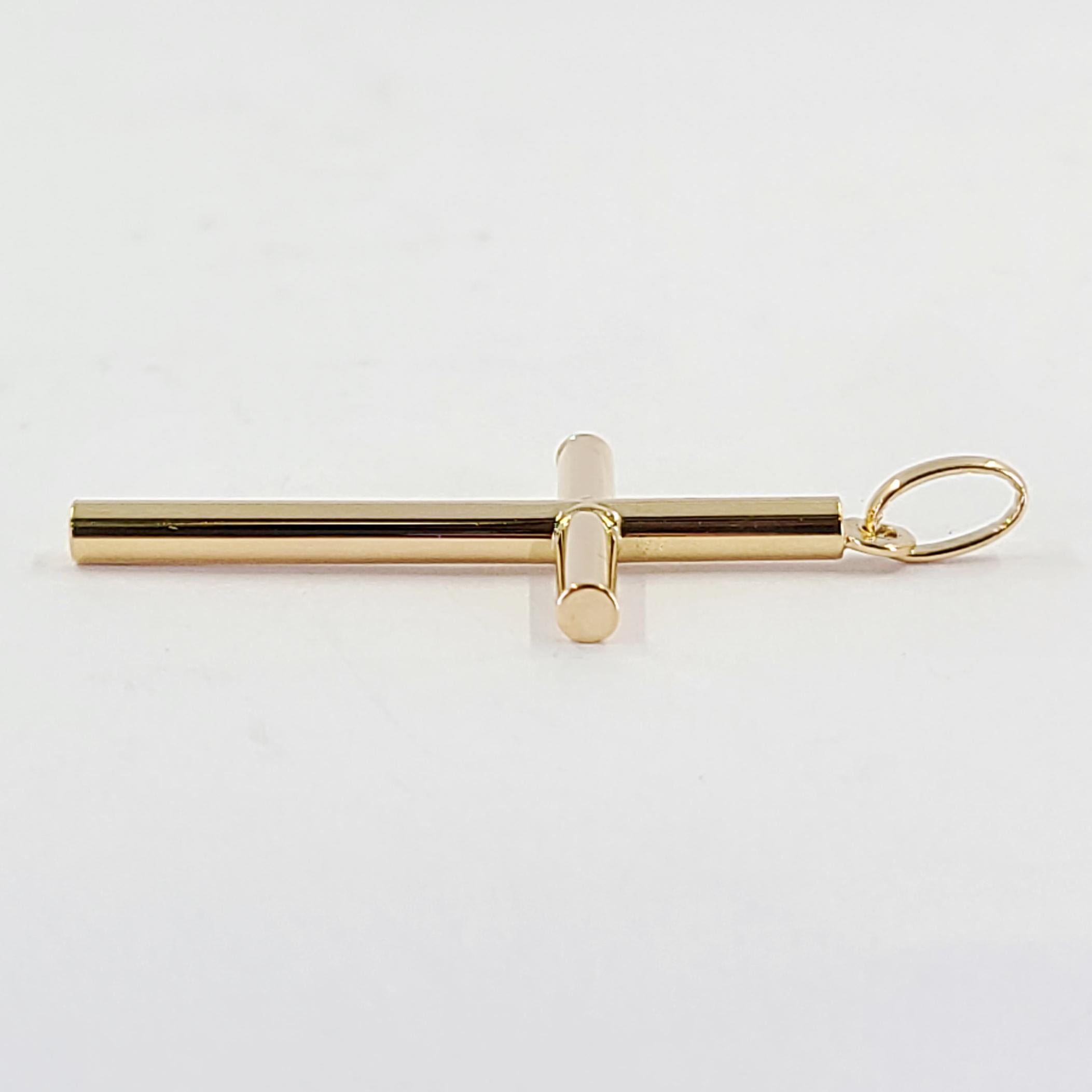 18 Karat Yellow Gold Large Rounded Tube Cross Measuring 1.75 Inches Long Including Bale. Finished Weight Is 2.4 Grams.