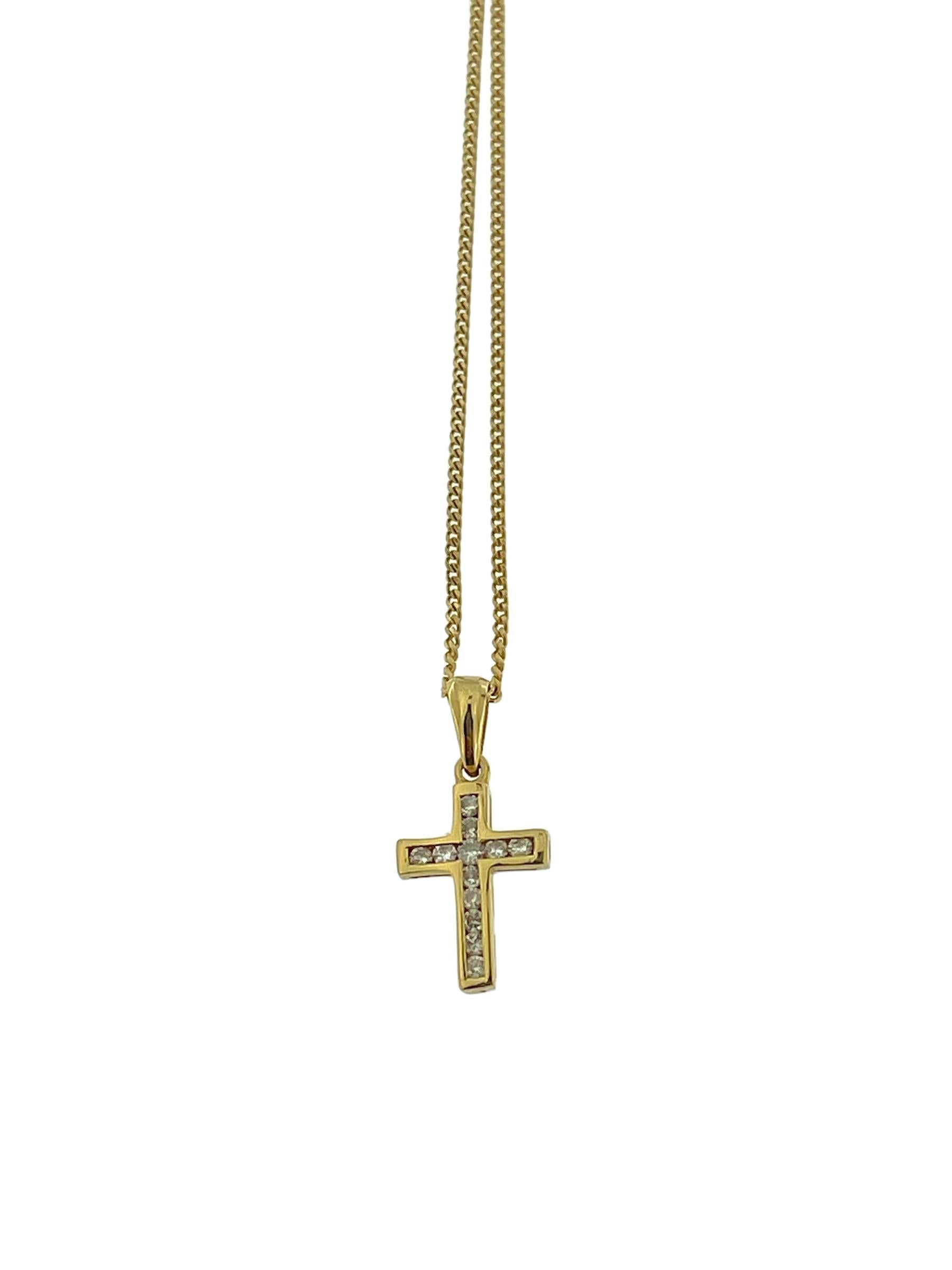 The Yellow Gold Cross with Diamonds and Chain is a stunning symbol of faith and elegance. Crafted from 18-karat yellow gold, this cross pendant is adorned with dazzling diamonds channel-set, adding a touch of sparkle and sophistication to the
