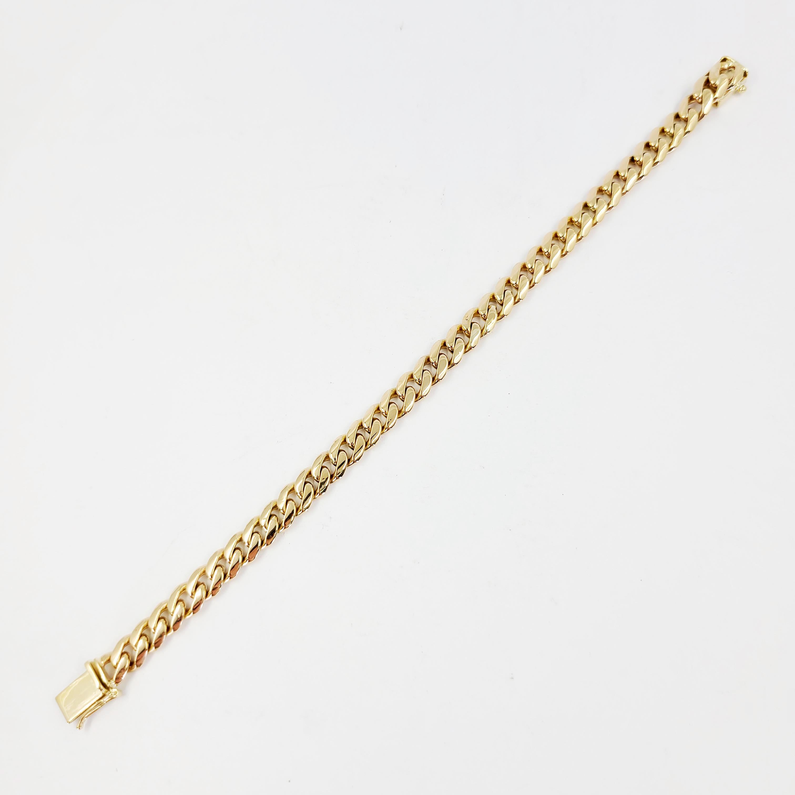 14 Karat Yellow Gold 6.5mm Cuban Chain Bracelet Measuring 7 Inches Long. Box Clasp With Figure 8 Safety. Finished Weight Is 22.6 Grams.