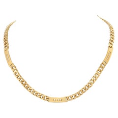 Yellow gold Cuban Link choker with bar stations and diamond accents