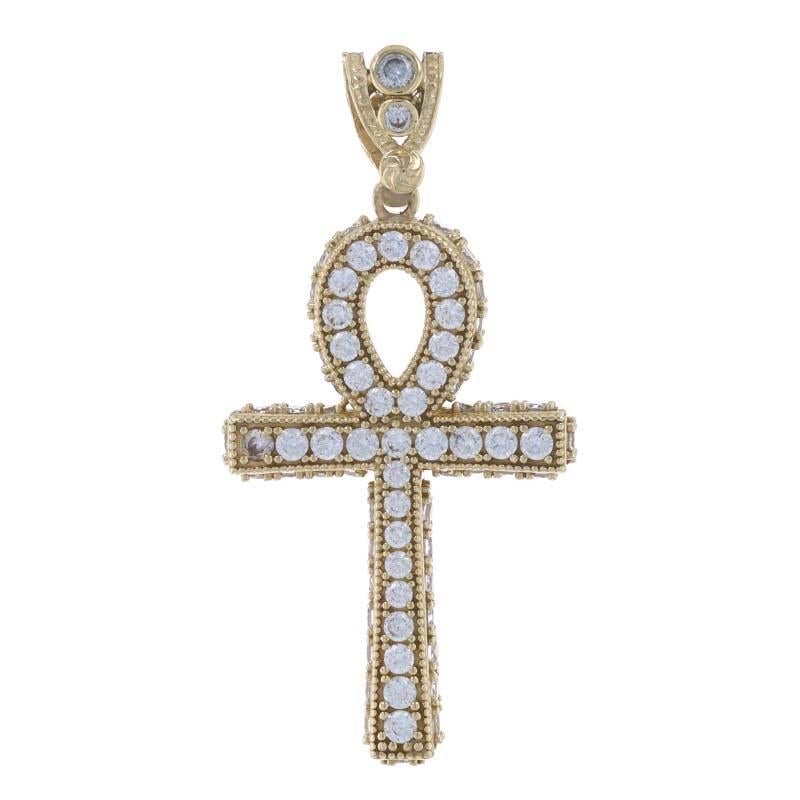 Metal Content: 10k Yellow Gold

Stone Information
Cubic Zirconias
Total Carat(s): 3.75ctw dew
Cut: Round Brilliant 
Color: Clear

Theme:  Egyptian Ankh, Hieroglyph, Life Faith 
Features: Milgrain Detailing

Measurements
Tall (from extended bail): 2
