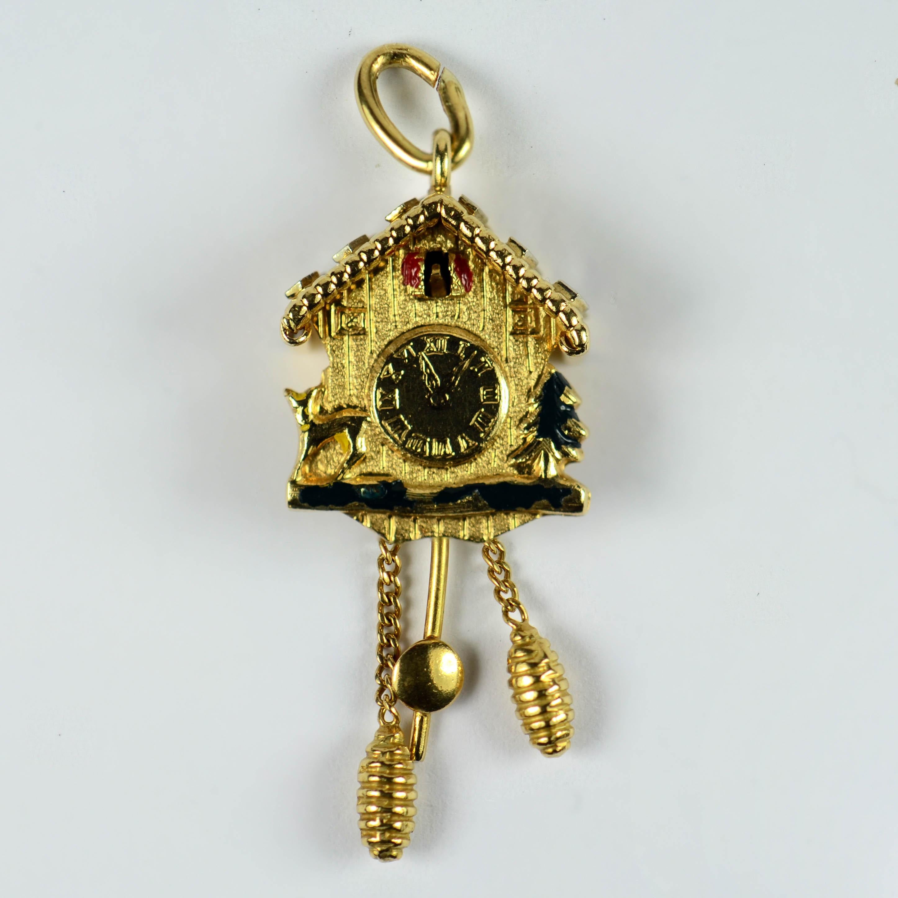 An 18 karat gold charm pendant designed as a cuckoo clock with moveable weights and pendulum. The front depicts a Christmas tree and a deer with traces of enamel. The roof is studded with white gold rhombs. 
Marked 750 for 18 karat gold, and CB for