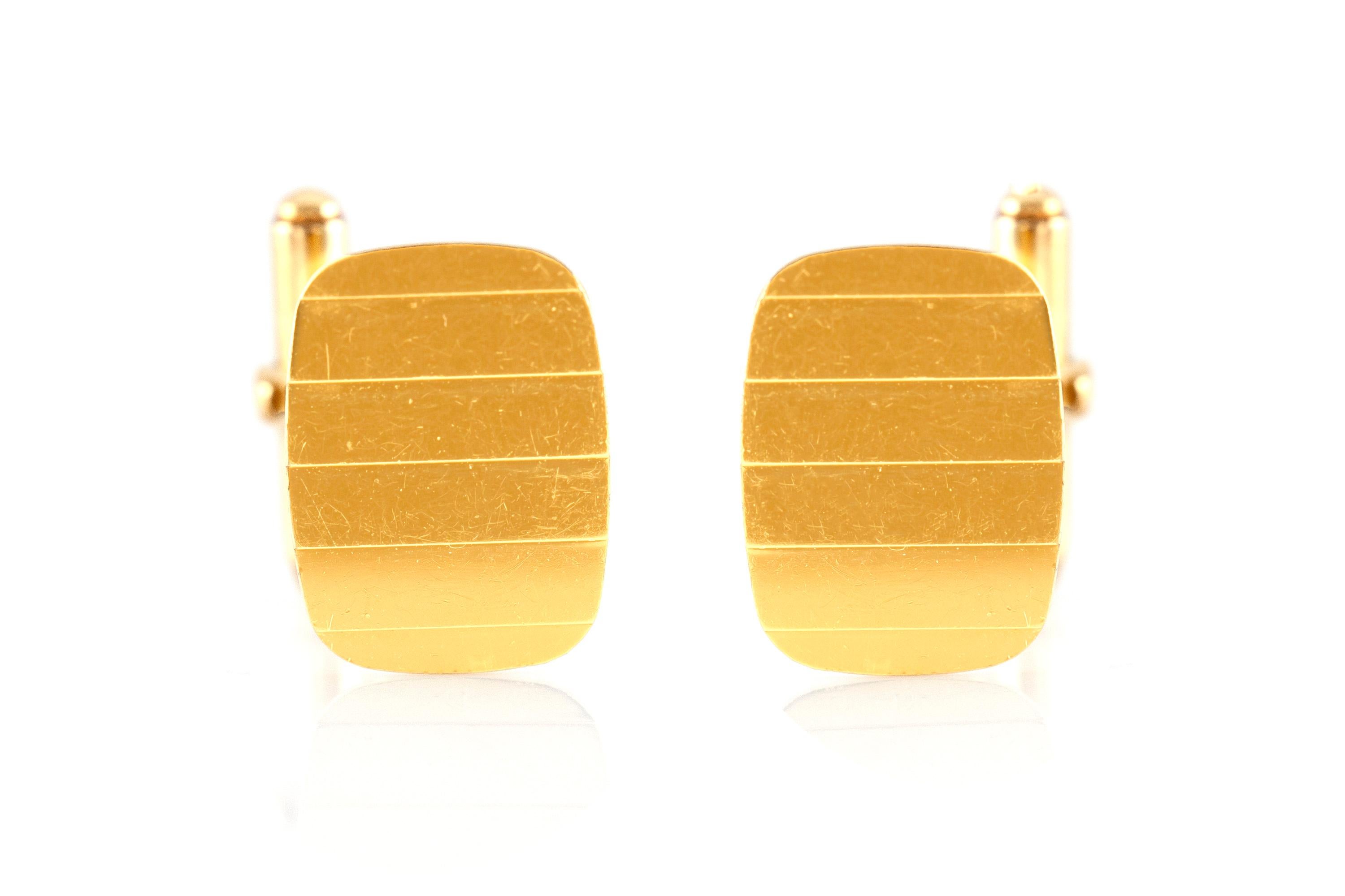 Cufflinks finely crafted in 18k yellow gold weighing a total of 3.6 dwt., size of each cufflink is 0.75 inch. Circa 1990.