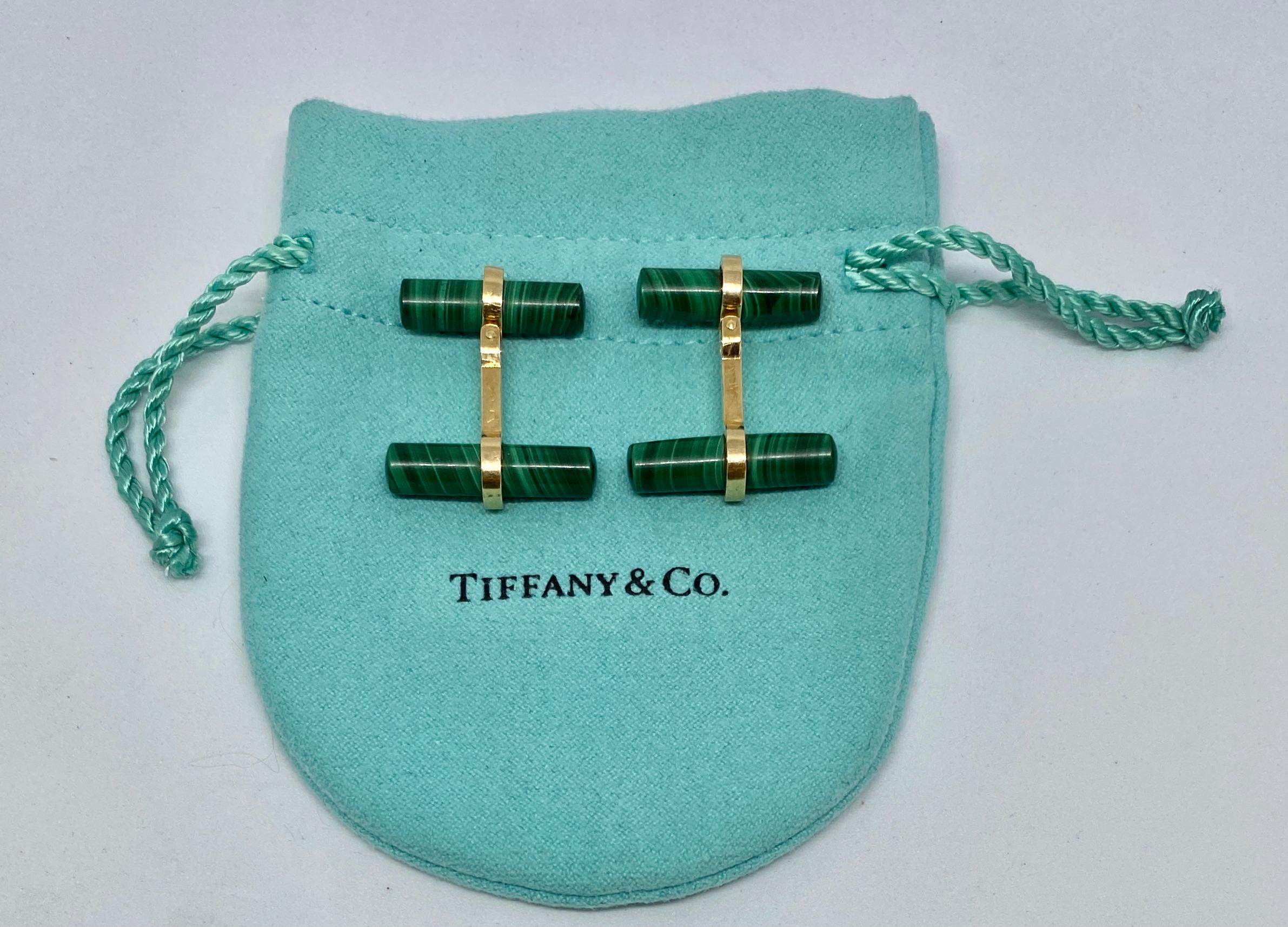 Wonderful and classic cufflinks featuring four malachite batons set in 14K yellow gold and signed Tiffany & Co.

This is among the most sought-after cufflink designs: tasteful, versatile and distinctive. Made in the Tiffany workrooms, the