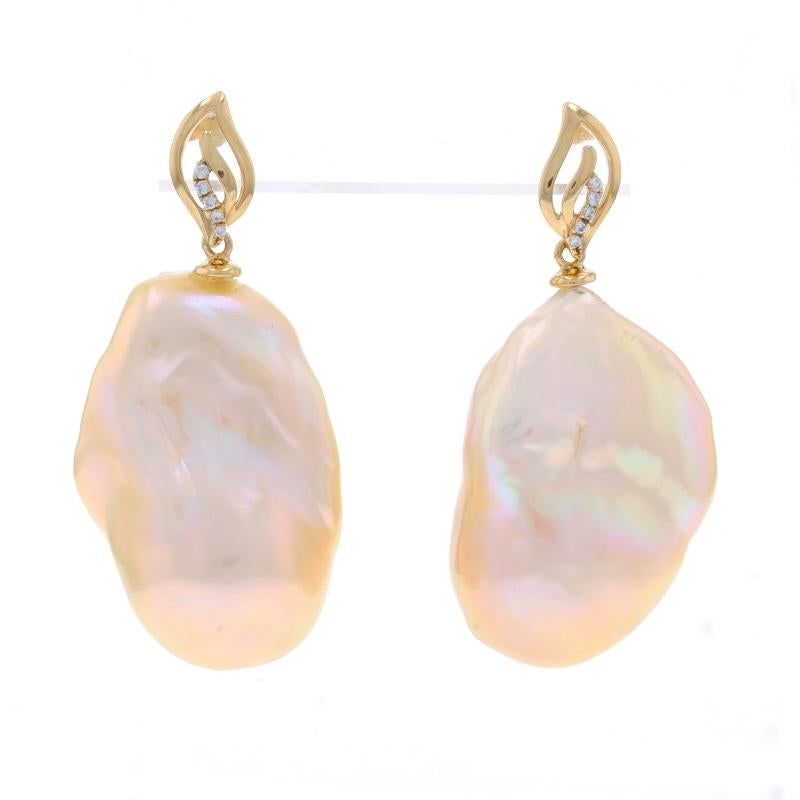 Metal Content: 18k Yellow Gold

Stone Information
Cultured Baroque Pearls
Color: Light Peach

Natural Diamonds
Carat(s): .06ctw
Cut: Round Brilliant
Color: G - H
Clarity: SI1 - SI2

Style: Dangle
Fastening Type: Butterfly