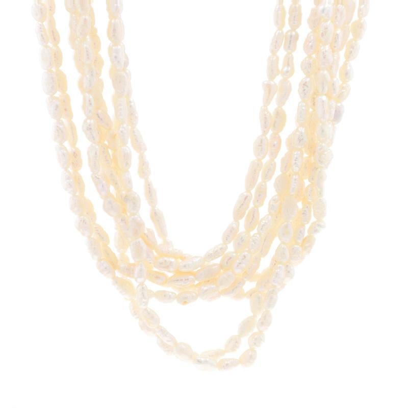 Metal Content: 14k Yellow Gold

Stone Information

Cultured Freshwater Pearls

Style: Nine-Strand
Fastening Type: Tab Clasp with Safety Bar

Measurements

Length: 17 1/4