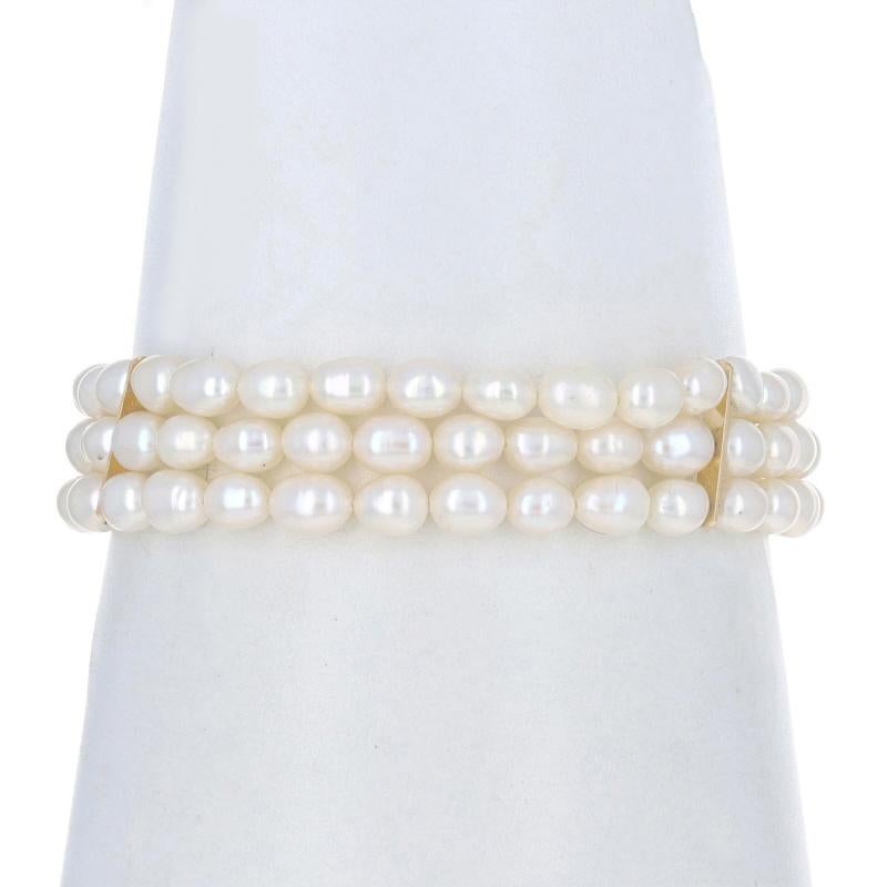 Metal Content: 14k Yellow Gold

Stone Information

Cultured Freshwater Pearls
Color: Cream

Style: Triple Strand
Fastening Type: Tab Box Clasp
Features: Floral Filigree & Milgrain Detailing on Clasp

Measurements

Length: 6 3/4
