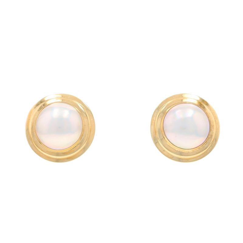 Metal Content: 14k Yellow Gold

Stone Information

Cultured Mabe Pearls
Size: 14.2mm

Style: Large Stud
Fastening Type: Omega Closures

Measurements

Diameter: 7/8