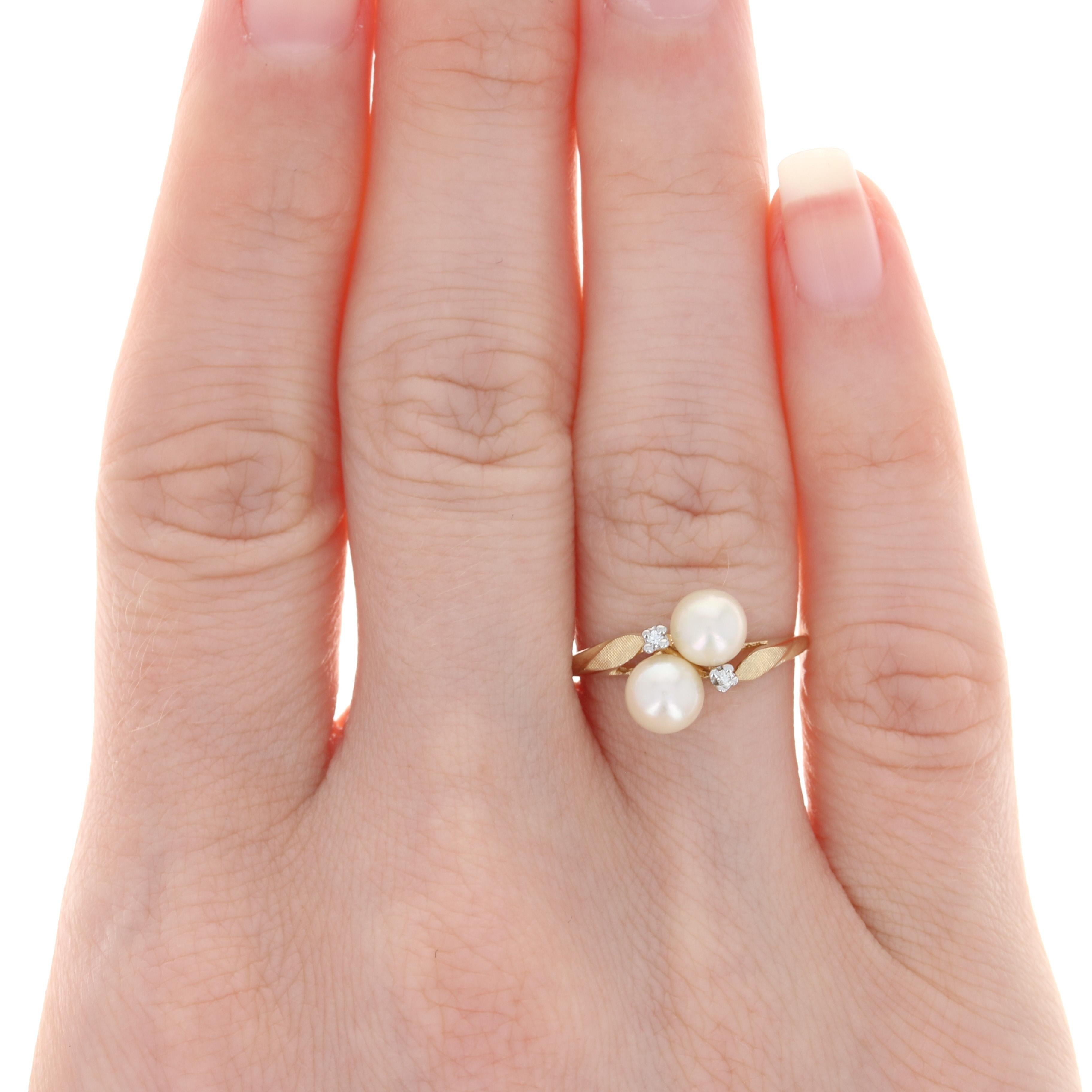 Size: 6 1/4
Sizing Fee: Down 2 sizes for a $20 fee or up 2 sizes for a $25 fee

Metal Content: 14k Yellow Gold & 14k White Gold

Stone Information: 
Genuine Cultured Pearls

Natural Diamonds 
(two small accents)
Cut: Round Brilliant

Style: