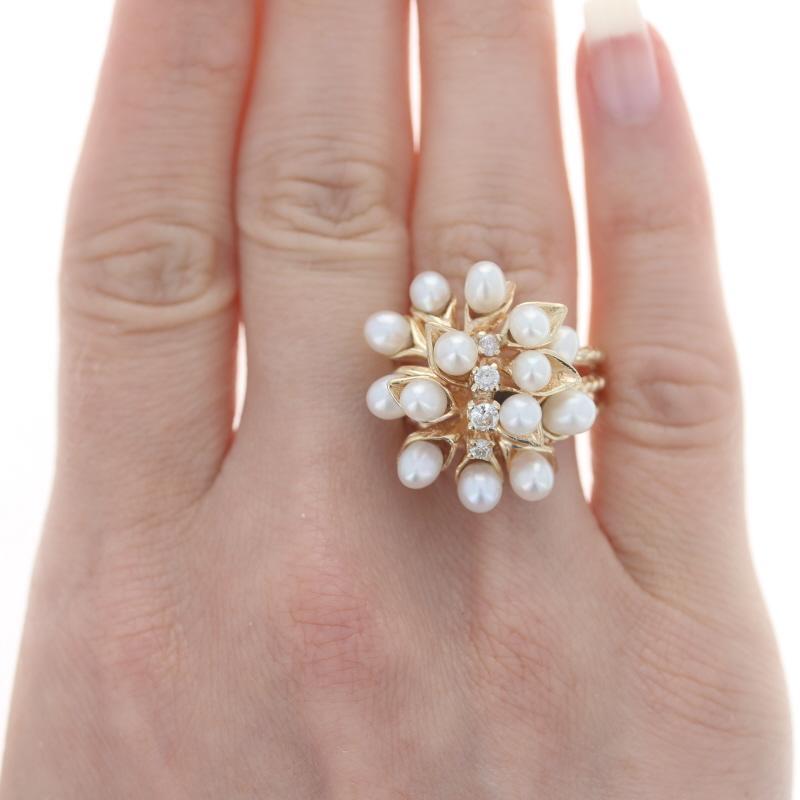 Size: 8 1/4
Sizing Fee: Up 2 sizes for $40 or Down 3 sizes for $35

Metal Content: 14k Yellow Gold

Stone Information
Cultured Pearls
Color: White

Natural Diamonds
Carat(s): .22ctw
Cut: Round Brilliant
Color: G - H
Clarity: I1

Total Carats: