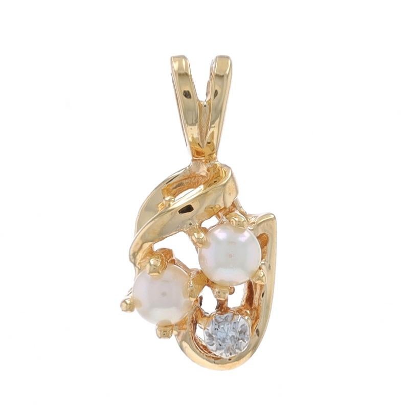 Metal Content: 10k Yellow Gold & 10k White Gold

Stone Information

Cultured Pearls
Size: 3.1mm

Natural Diamond
Cut: Single
Stone Note: (one small accent)

Style: Cluster

Measurements

Tall (from stationary bail): 5/8