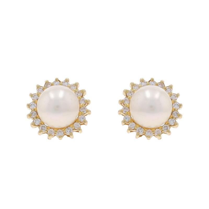 Metal Content: 14k Yellow Gold

Stone Information

Cultured Pearls
Color: White
Size: 7mm

Natural Diamonds
Carat(s): .18ctw
Cut: Round Brilliant
Color: G - H
Clarity: SI1 - SI2

Total Carats: .18ctw

Style: Halo Stud
Fastening Type: Butterfly