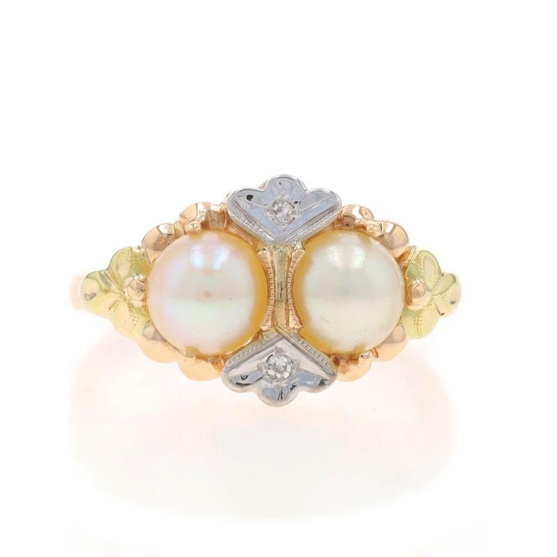 Size: 5 1/2

Metal Content: 10k Yellow Gold & 10k White Gold

Stone Information
Cultured Pearls

Natural Diamonds
Cut: Single
Stone Note: (two small accents)

Style: Two-Stone with Accents
Features: Milgrain Detailing

Measurements
Face Height