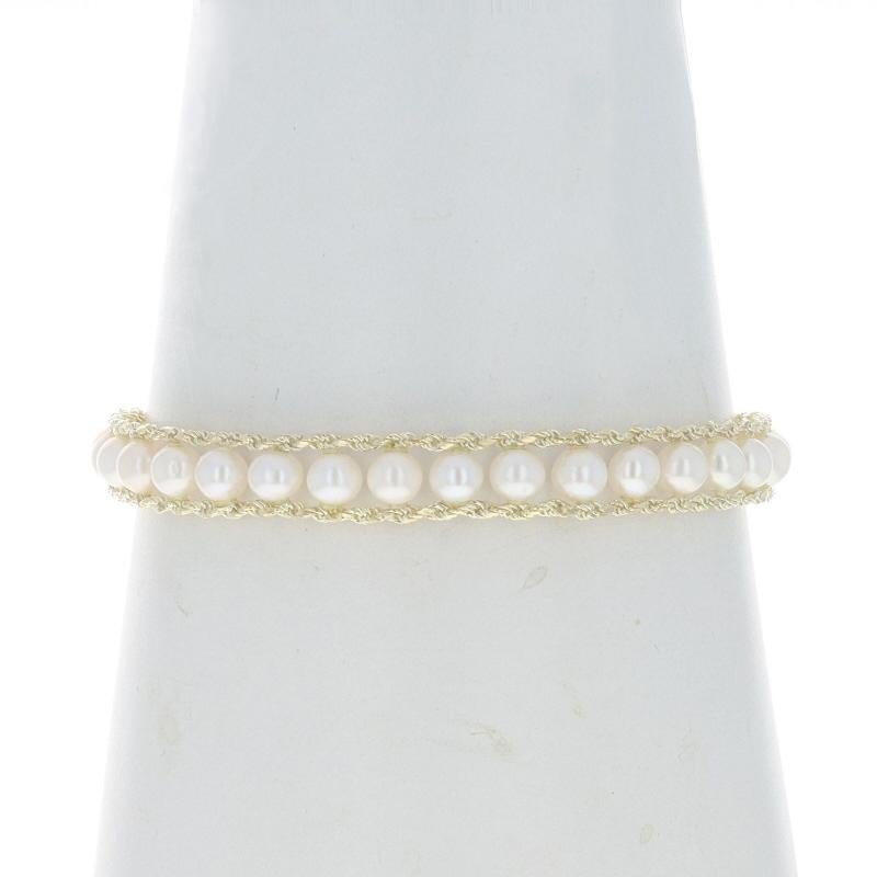 Metal Content: 14k Yellow Gold

Stone Information

Cultured Pearls
Color: White
Size: 4.7mm - 5.1mm

Style: Link
Chain Style: Diamond Cut Rope
Fastening Type: Tab Box Clasp with One Side Safety Clasp
Features: Crosshatch Clasp