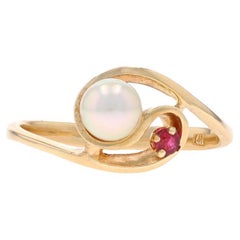 Anillo Bypass de Oro Amarillo con Perla Cultivada y Rubí - 14k