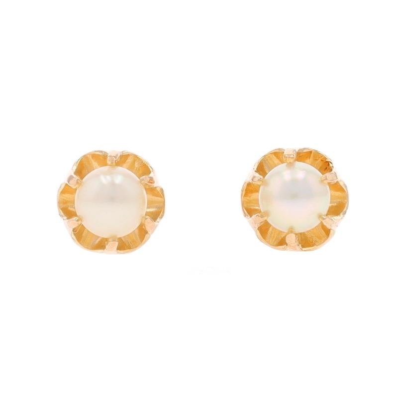 Metal Content: 14k Yellow Gold

Stone Information

Cultured Pearls
Color: White
Size: 4mm

Style: Stud
Fastening Type: Pierced Screw-On Closures
Features: Buttercup Mounts

Measurements

Tall: 1/4